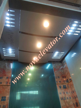 Lift Cabin with Wooden and Stainless Steel Decorations